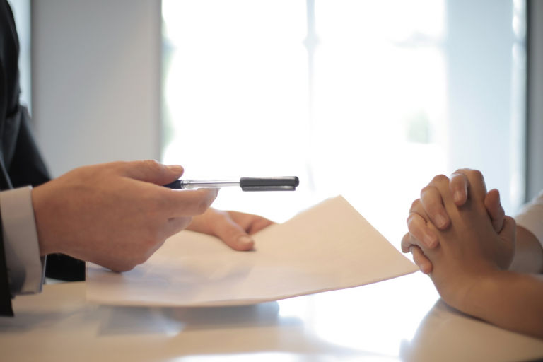 Handing out a contract to someone